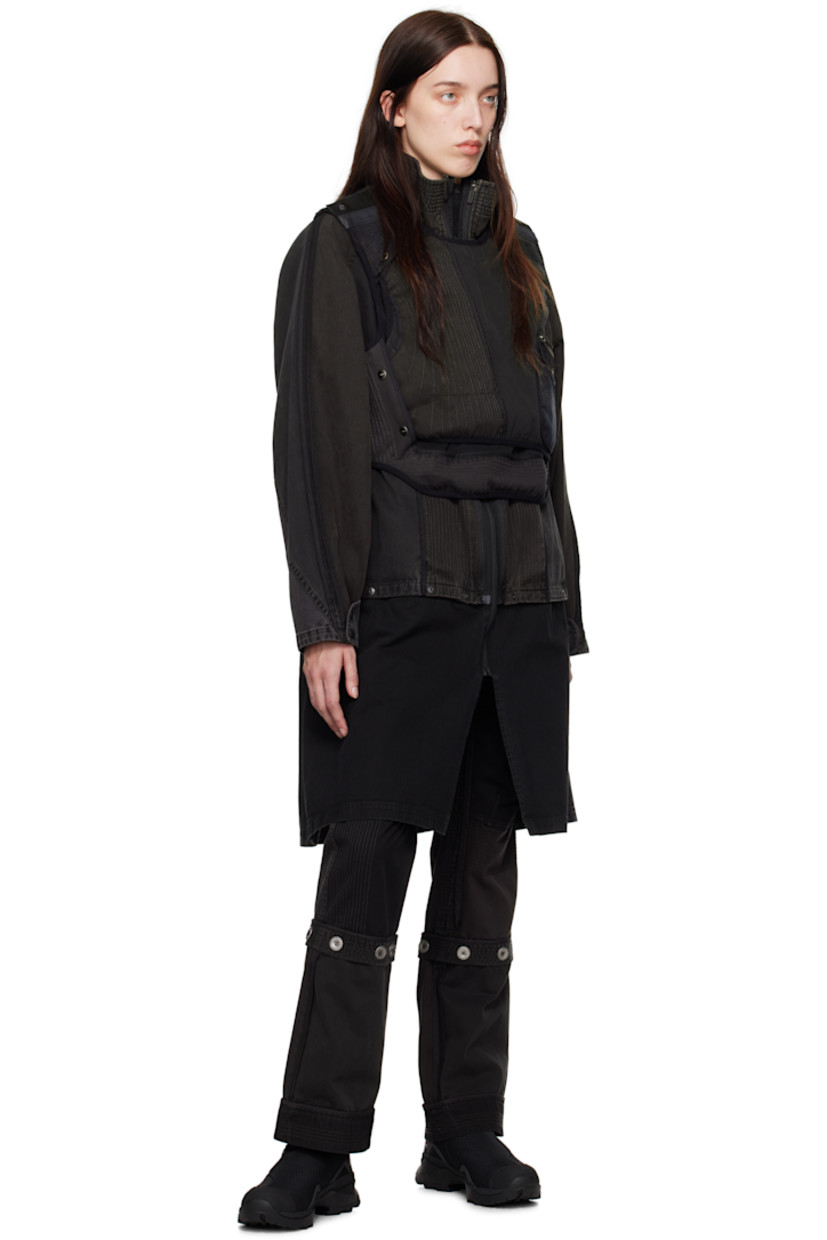 Reversible cotton twill vest. Topstitching, webbing trim, and press-stud fastenings throughout. 

Reverse in khaki virgin wool flannel. Webbing trim throughout. 

· Layered construction 
· Detachable panel at front 
· Round neck 
· Pen slots at chest
· Zip pocket and flap pocket at front 
· Press-stud fastening at side seams
· Asymmetric curved hem
· Logo-engraved silver-tone hardware 

Supplier color: Stone