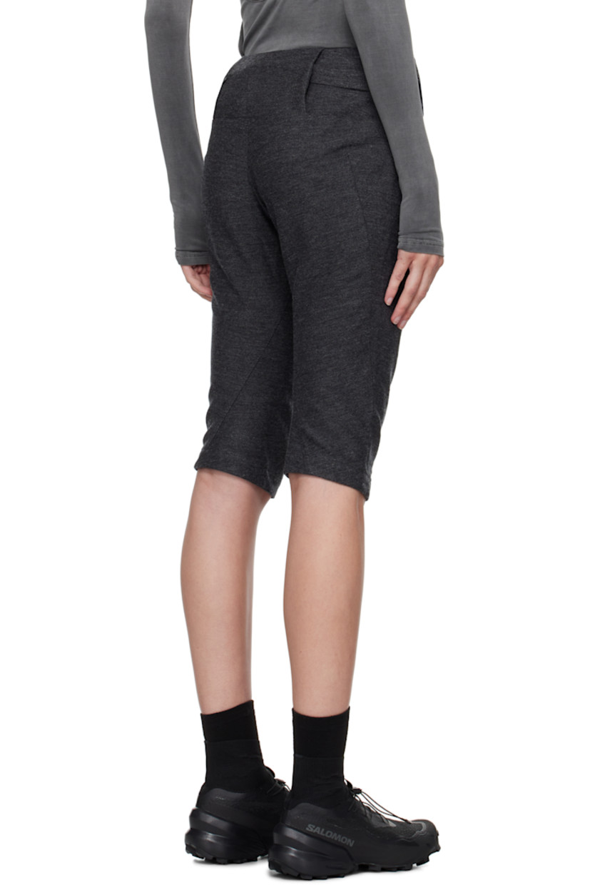 Cotton- and wool-blend twill trousers. Darts throughout. 

· Graphic charms at detachable zip pouch 
· Two-pocket styling 
· Cropped legs
· Zip closure at outseam 
· Twisted outseams 
· Belt loop at back waist 
· Zip pocket at back 

Supplier color: Grey