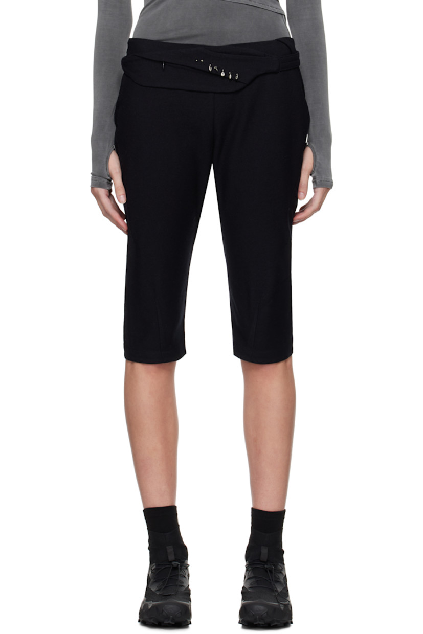 Cotton- and wool-blend twill trousers. Darts throughout. 

· Graphic charms at detachable zip pouch 
· Two-pocket styling 
· Cropped legs
· Zip closure at outseam 
· Twisted outseams 
· Belt loop at back waist 
· Zip pocket at back 

Supplier color: Black