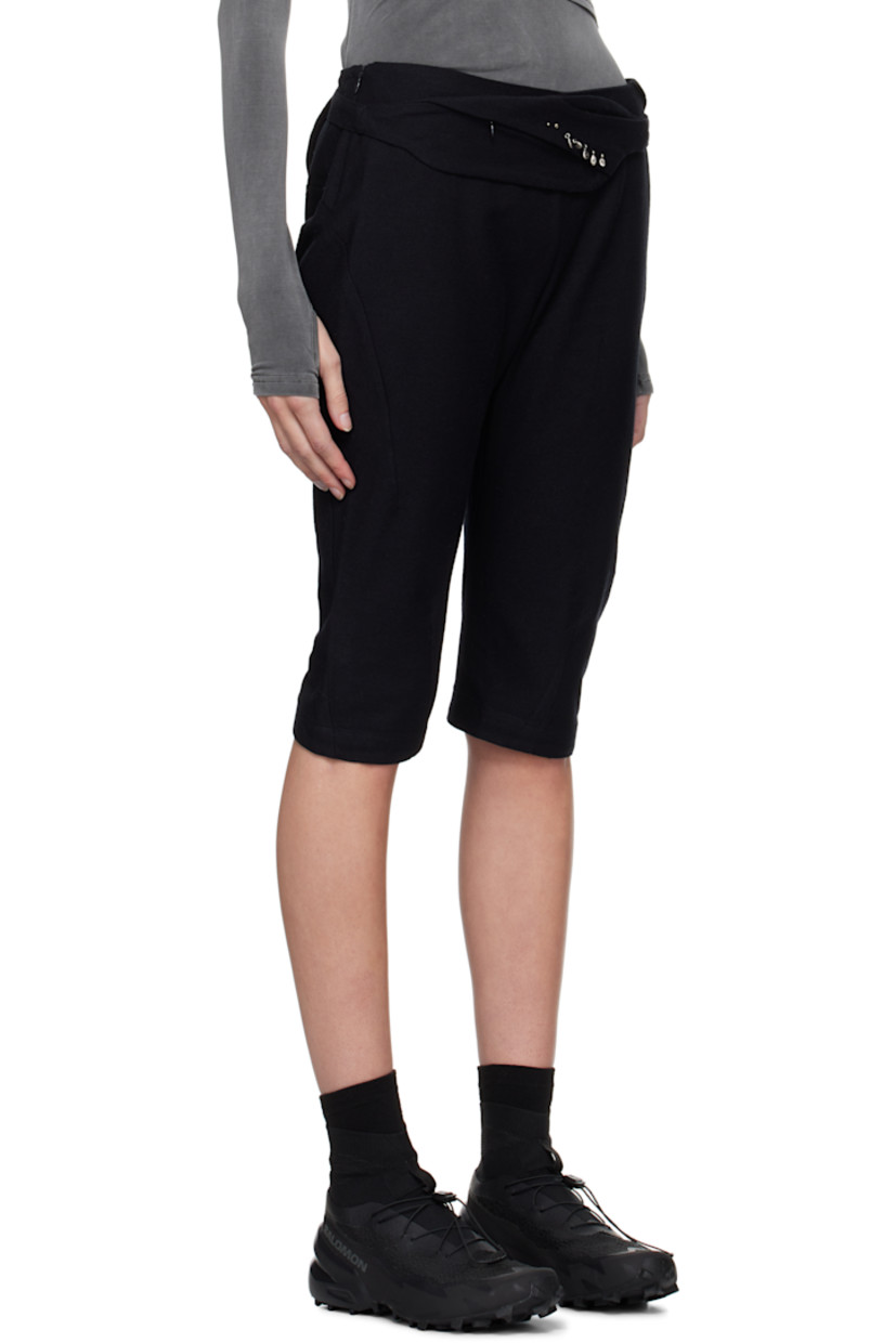 Cotton- and wool-blend twill trousers. Darts throughout. 

· Graphic charms at detachable zip pouch 
· Two-pocket styling 
· Cropped legs
· Zip closure at outseam 
· Twisted outseams 
· Belt loop at back waist 
· Zip pocket at back 

Supplier color: Black