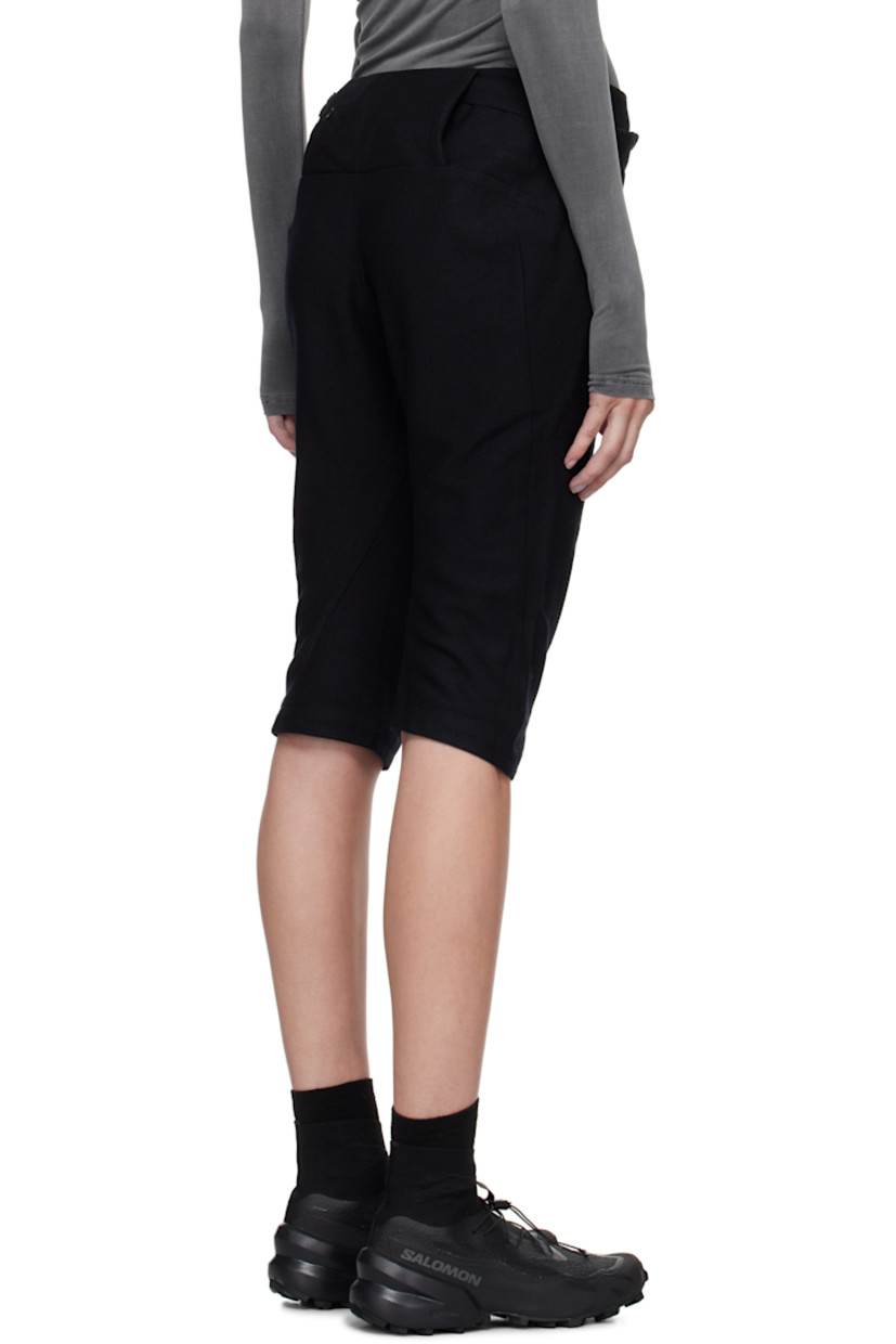 Cotton- and wool-blend twill trousers. Darts throughout. 

· Graphic charms at detachable zip pouch 
· Two-pocket styling 
· Cropped legs
· Zip closure at outseam 
· Twisted outseams 
· Belt loop at back waist 
· Zip pocket at back 

Supplier color: Black