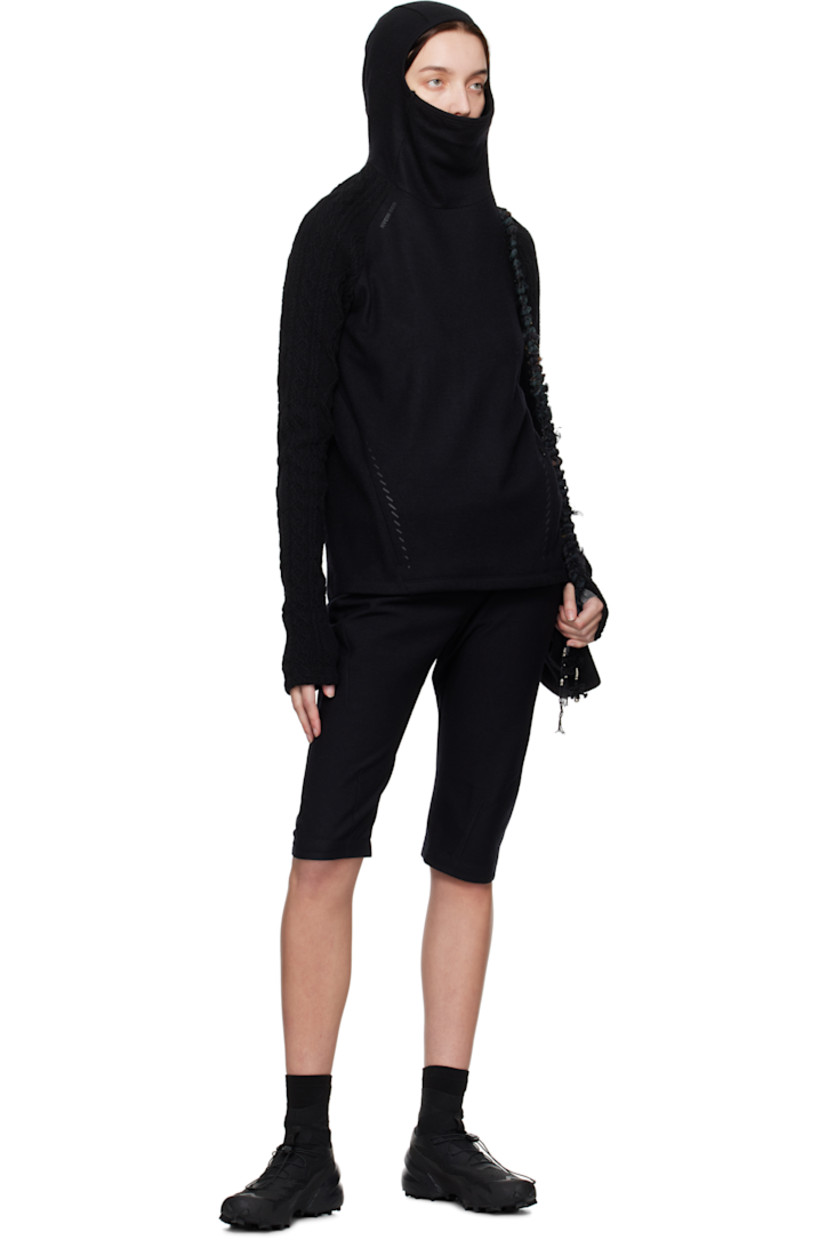 Cotton- and wool-blend twill trousers. Darts throughout. 

· Graphic charms at detachable zip pouch 
· Two-pocket styling 
· Cropped legs
· Zip closure at outseam 
· Twisted outseams 
· Belt loop at back waist 
· Zip pocket at back 

Supplier color: Black