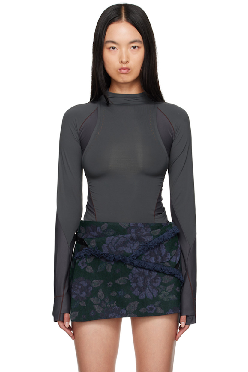 Stretch nylon jersey and ribbed jersey long sleeve T-shirt. 

· Paneled and layered construction
· Mock neck
· Logo-printed integrated straps at waist
· Thumbhole at cuffs
· Zip pockets at back
 
Supplier color: Charcoal