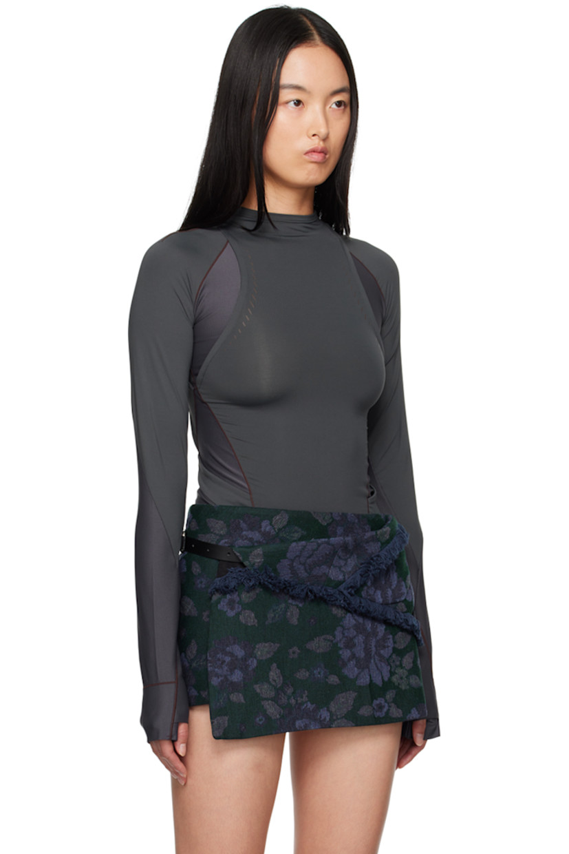 Stretch nylon jersey and ribbed jersey long sleeve T-shirt. 

· Paneled and layered construction
· Mock neck
· Logo-printed integrated straps at waist
· Thumbhole at cuffs
· Zip pockets at back
 
Supplier color: Charcoal