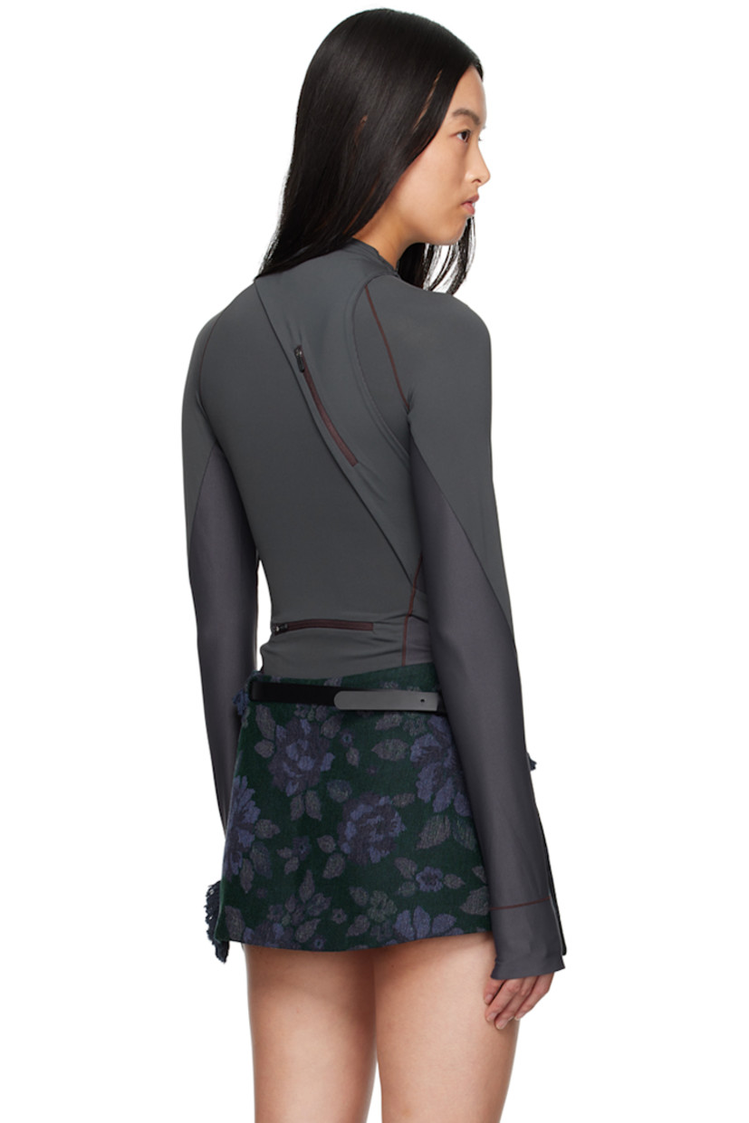 Stretch nylon jersey and ribbed jersey long sleeve T-shirt. 

· Paneled and layered construction
· Mock neck
· Logo-printed integrated straps at waist
· Thumbhole at cuffs
· Zip pockets at back
 
Supplier color: Charcoal