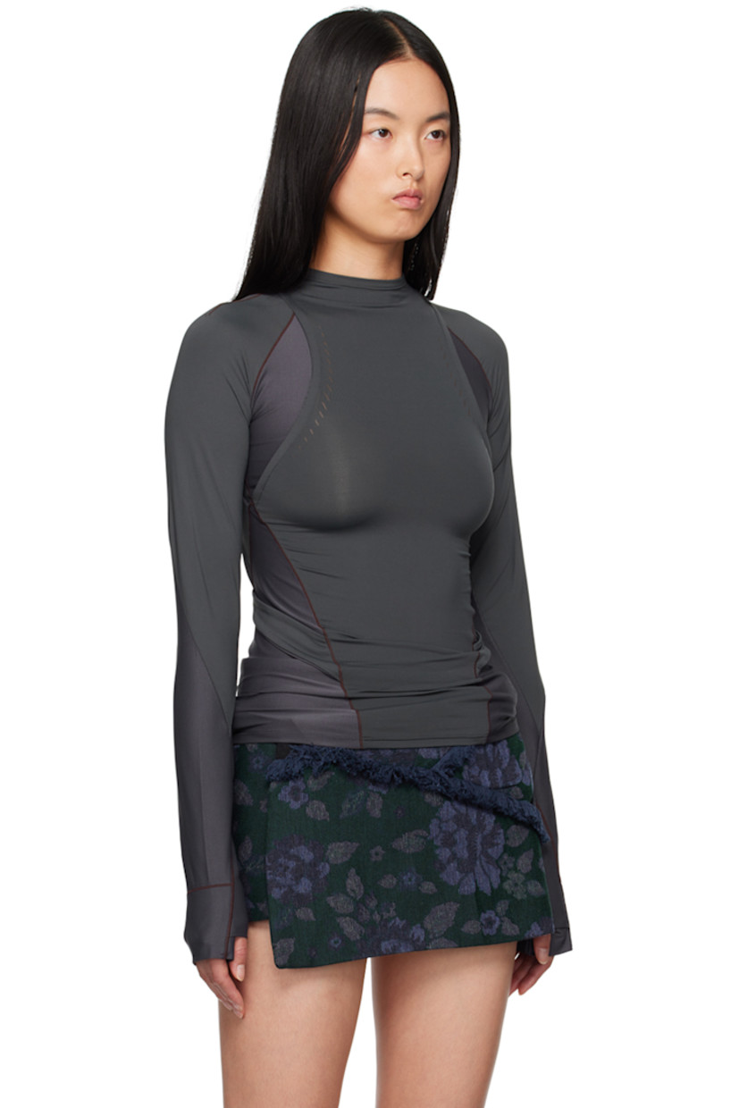 Stretch nylon jersey and ribbed jersey long sleeve T-shirt. 

· Paneled and layered construction
· Mock neck
· Logo-printed integrated straps at waist
· Thumbhole at cuffs
· Zip pockets at back
 
Supplier color: Charcoal