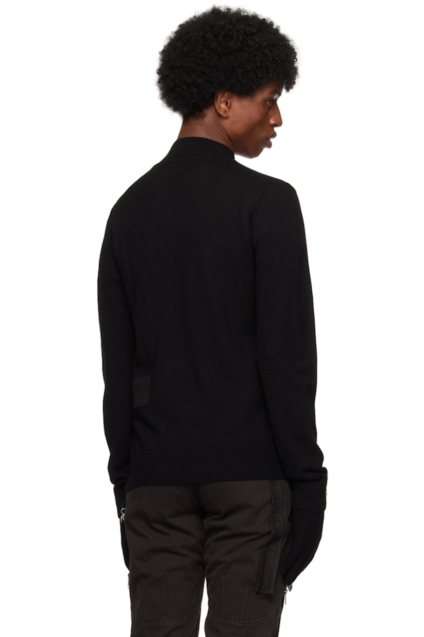 Knit extra fine wool turtleneck.

· Rib knit collar, hem, and cuffs
· Cotton twill trim at front and back
· Velcro tab at vented side seam
· Thumbhole at cuffs

Pair of knit extra fine wool gloves in black.

· Button hardware at rib knit cuffs
· Logo flag at cuffs

Supplier color: Black