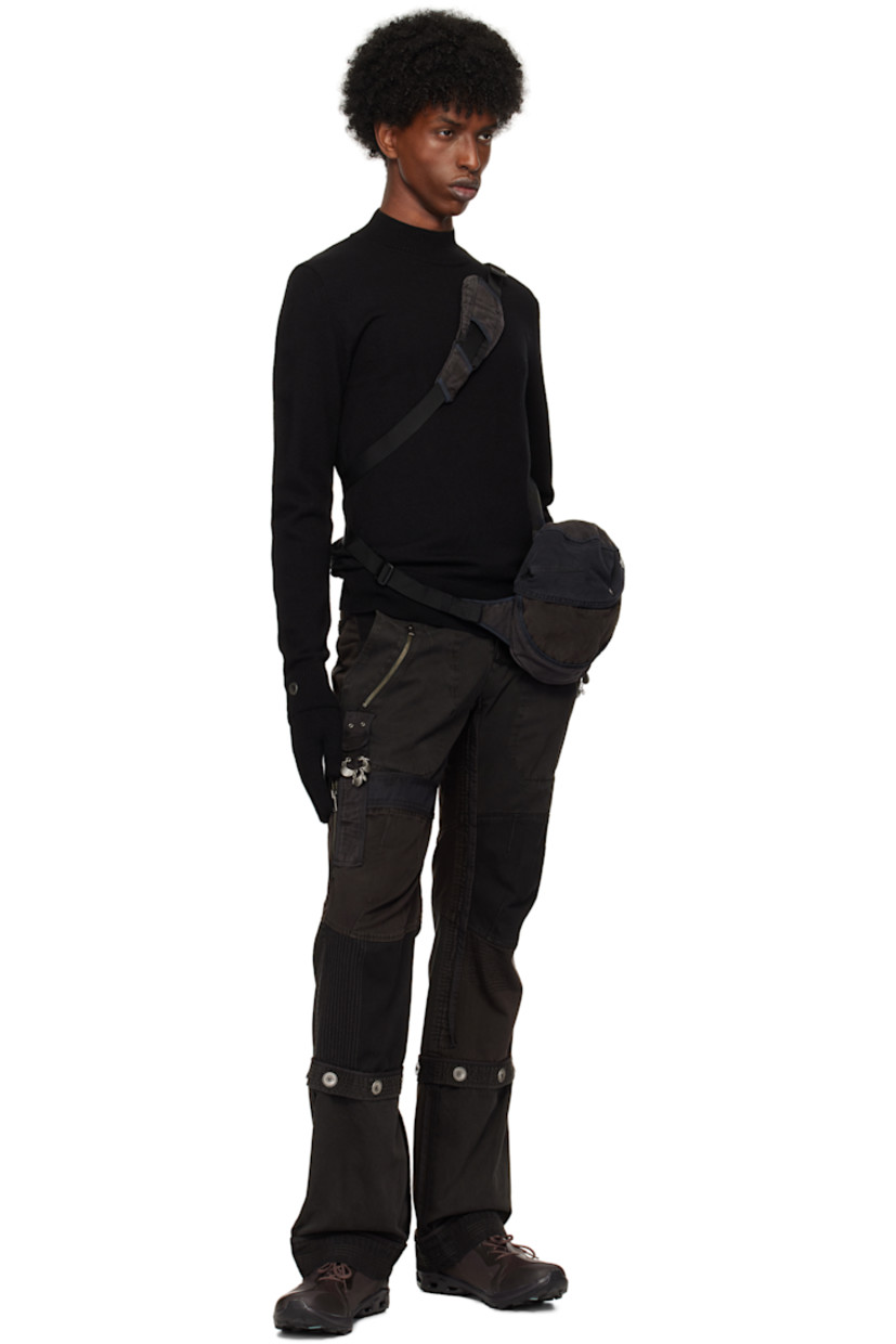 Knit extra fine wool turtleneck.

· Rib knit collar, hem, and cuffs
· Cotton twill trim at front and back
· Velcro tab at vented side seam
· Thumbhole at cuffs

Pair of knit extra fine wool gloves in black.

· Button hardware at rib knit cuffs
· Logo flag at cuffs

Supplier color: Black