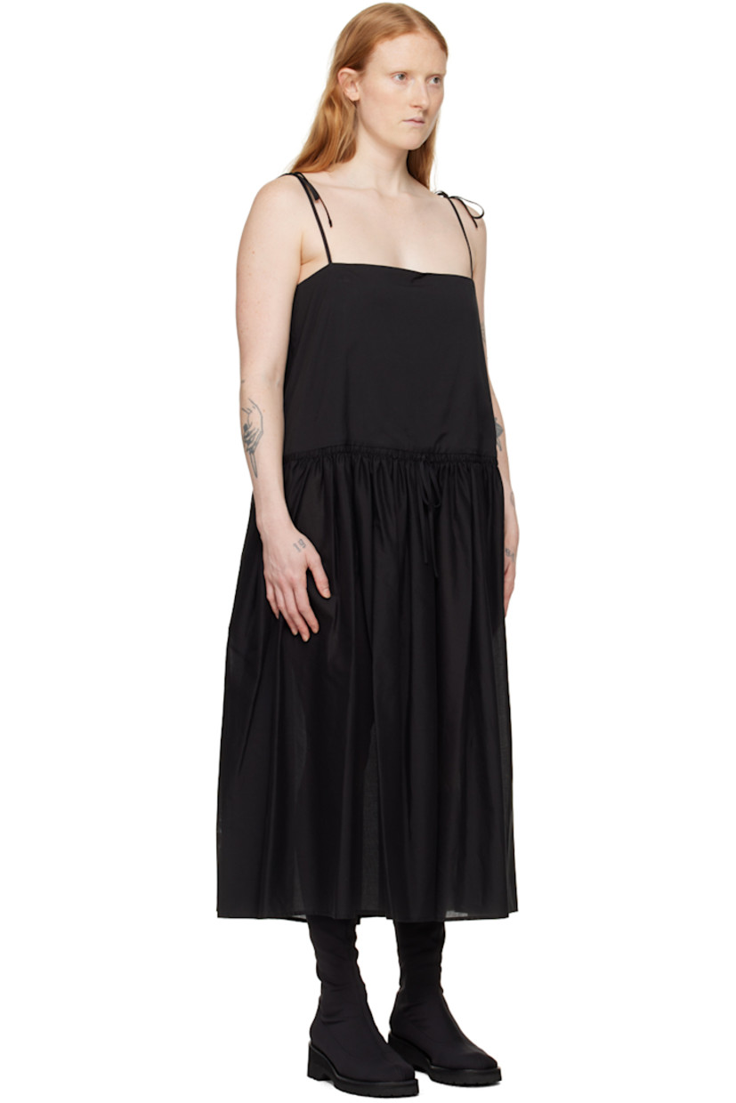 Semi-sheer cotton broadcloth dress. Shirring throughout.

· Square neck
· Drawstring and pleats at waist
· Seam pockets
· Concealed zip closure at side seam
· Self-tie spaghetti straps
· Partial broadcloth lining

Supplier color: Black