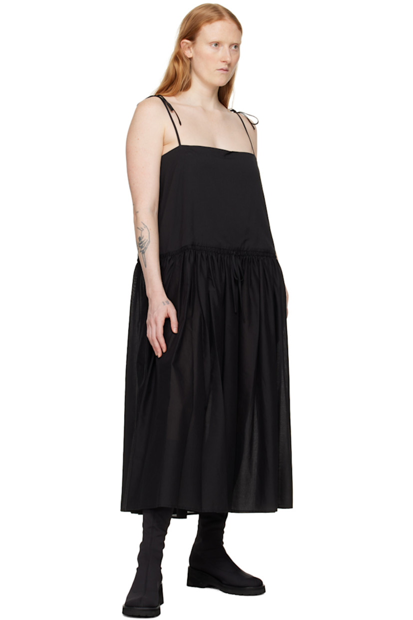 Semi-sheer cotton broadcloth dress. Shirring throughout.

· Square neck
· Drawstring and pleats at waist
· Seam pockets
· Concealed zip closure at side seam
· Self-tie spaghetti straps
· Partial broadcloth lining

Supplier color: Black