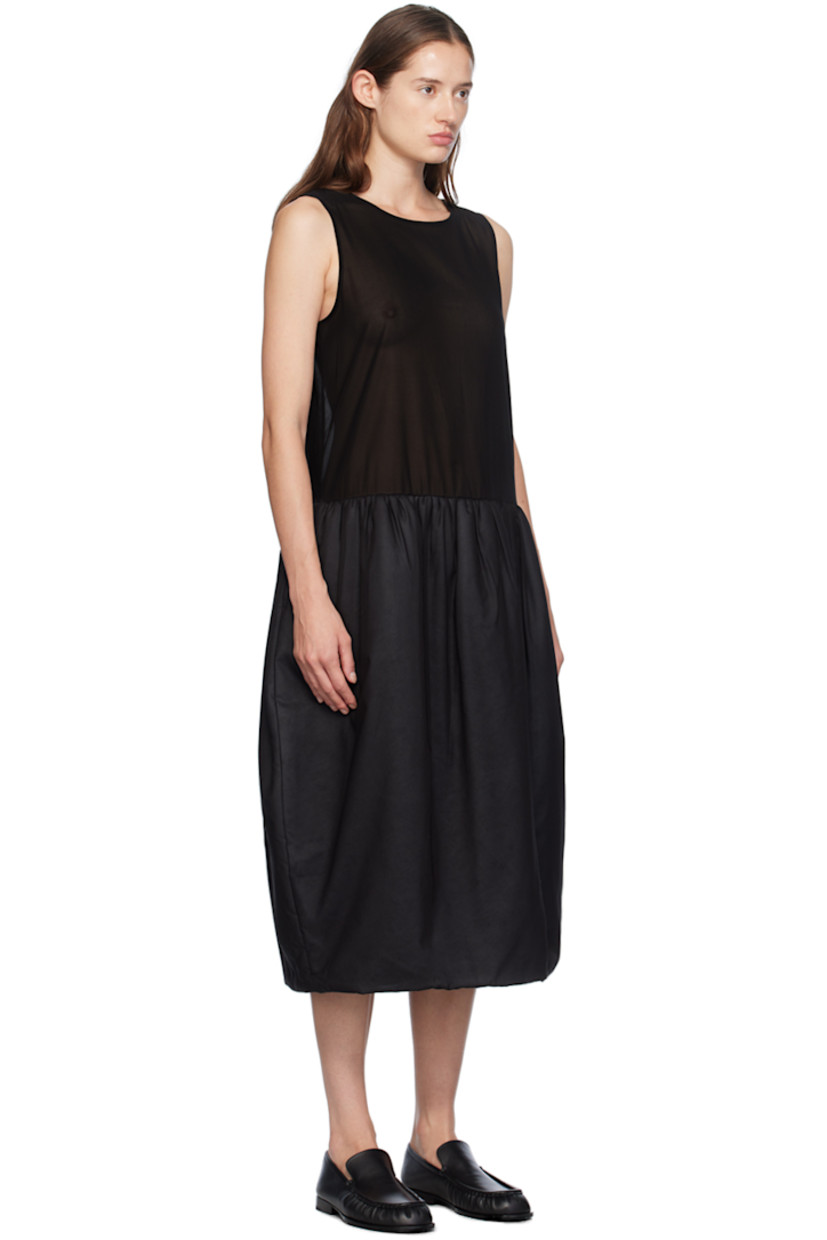 Sheer cotton muslin dress.

· Round neck
· Gathering at waist
· Padded skirt
· Welt pockets
· Zip closure at back
· Partial satin lining

Supplier color: Black