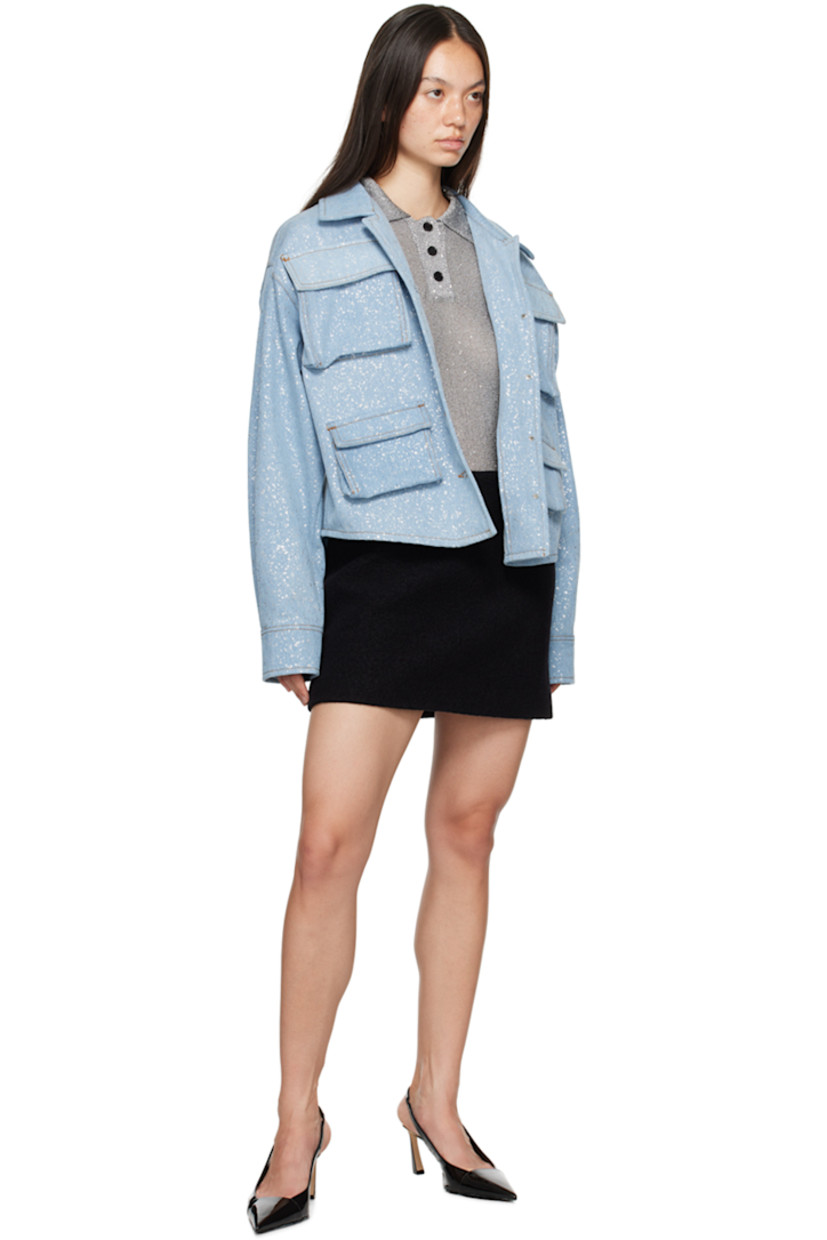 Knit polyester polo. Sequins throughout. 

· Rib knit spread collar, hem, and cuffs
· Three-button placket
· Unlined

Supplier color: Grey