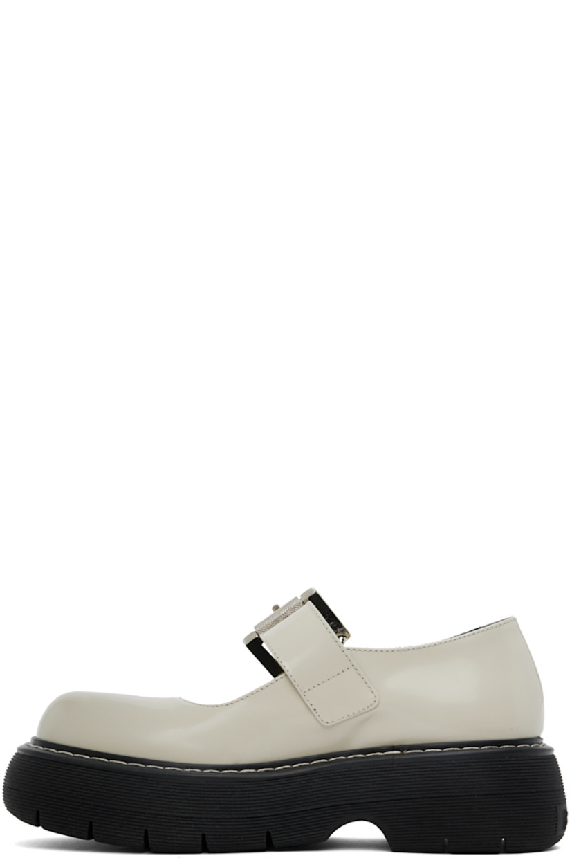 Polished leather Mary Jane-style loafers in off-white.

· Logo-engraved pin-buckle strap at vamp
· Logo patch at cushioned footbed
· Topstitching at welt
· Logo embossed at rubber platform midsole
· Treaded rubber sole

Supplier color: Off-white