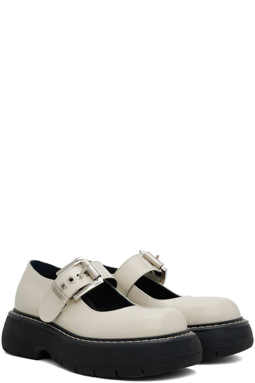 Polished leather Mary Jane-style loafers in off-white.

· Logo-engraved pin-buckle strap at vamp
· Logo patch at cushioned footbed
· Topstitching at welt
· Logo embossed at rubber platform midsole
· Treaded rubber sole

Supplier color: Off-white