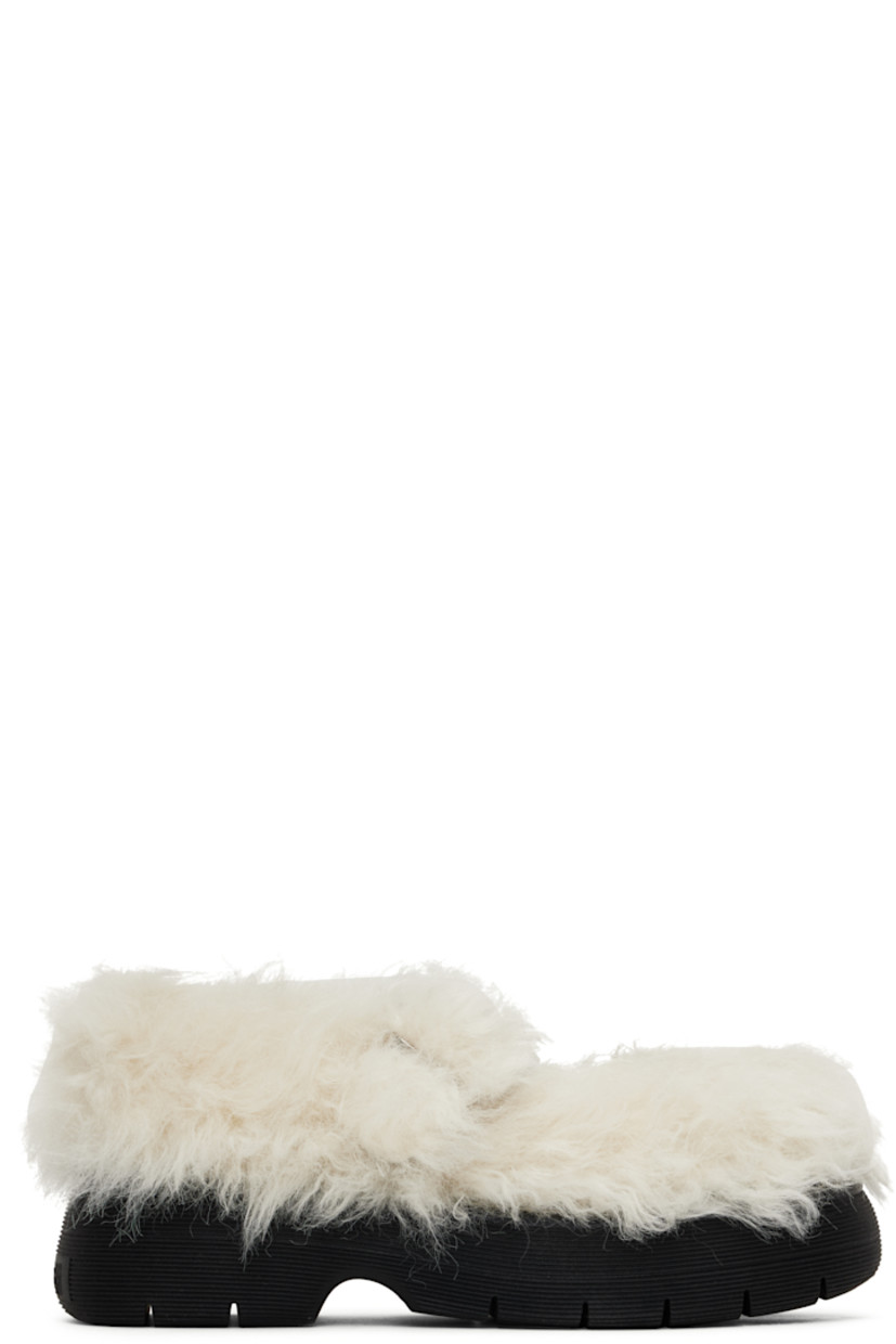 Faux-fur Mary Jane-style loafers in off-white.

· Pin-buckle strap at vamp
· Logo patch at padded footbed
· Buffed calfskin lining
· Topstitching at welt
· Logo embossed at platform rubber midsole
· Treaded rubber sole
· Platform: H1.5"

Supplier color: Off white