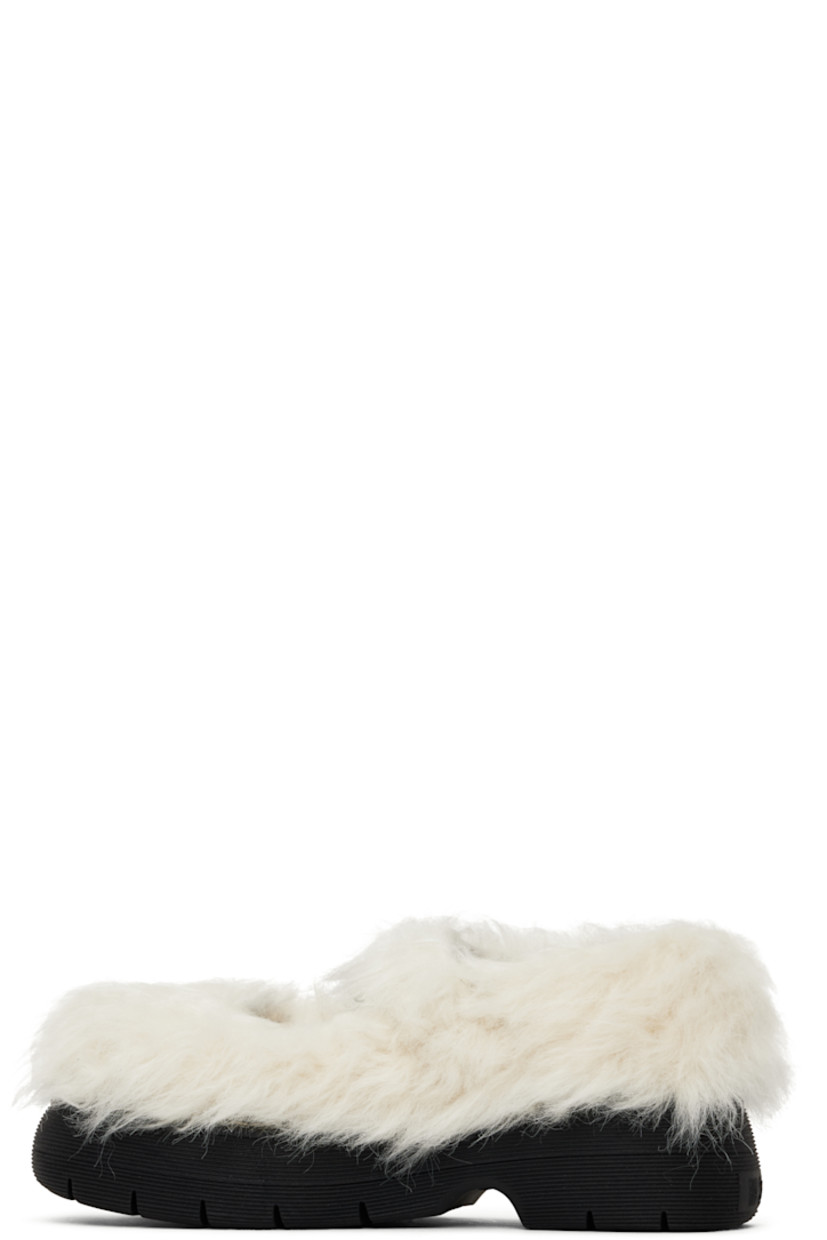 Faux-fur Mary Jane-style loafers in off-white.

· Pin-buckle strap at vamp
· Logo patch at padded footbed
· Buffed calfskin lining
· Topstitching at welt
· Logo embossed at platform rubber midsole
· Treaded rubber sole
· Platform: H1.5"

Supplier color: Off white