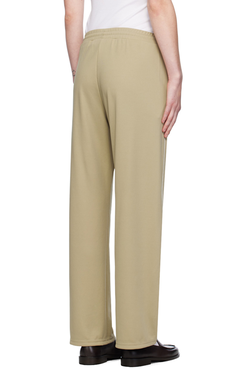 COOLMAX® EcoMade polyester-blend piqué track pants.

· Concealed drawstring at elasticized waistband
· Two-pocket styling
· Logo graphic embroidered at front
· Piping at outseams

Supplier color: Elephant