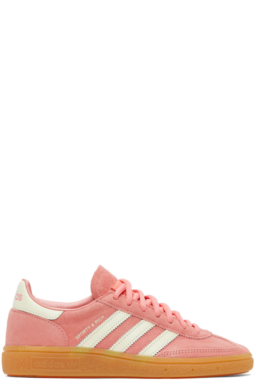 Low-top suede and buffed leather sneakers in pink and white.

· Lace-up closure
· Logo patch at tongue 
· Signature serrated stripes at sides
· Logo stamp at outer side and heel
· Treaded rubber sole

Part of the Sporty & Rich x adidas Originals collaboration. 

Supplier color: Pantone/Cream white/Gum