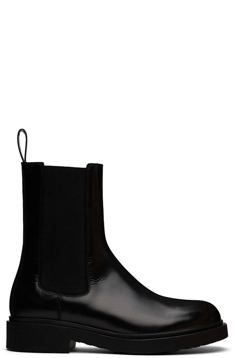 Ankle-high buffed leather Chelsea boots in black.

· Elasticized gusset at sides
· Pull-loop at heel collar
· Foam rubber midsole
· Treaded rubber sole

Supplier color: Black