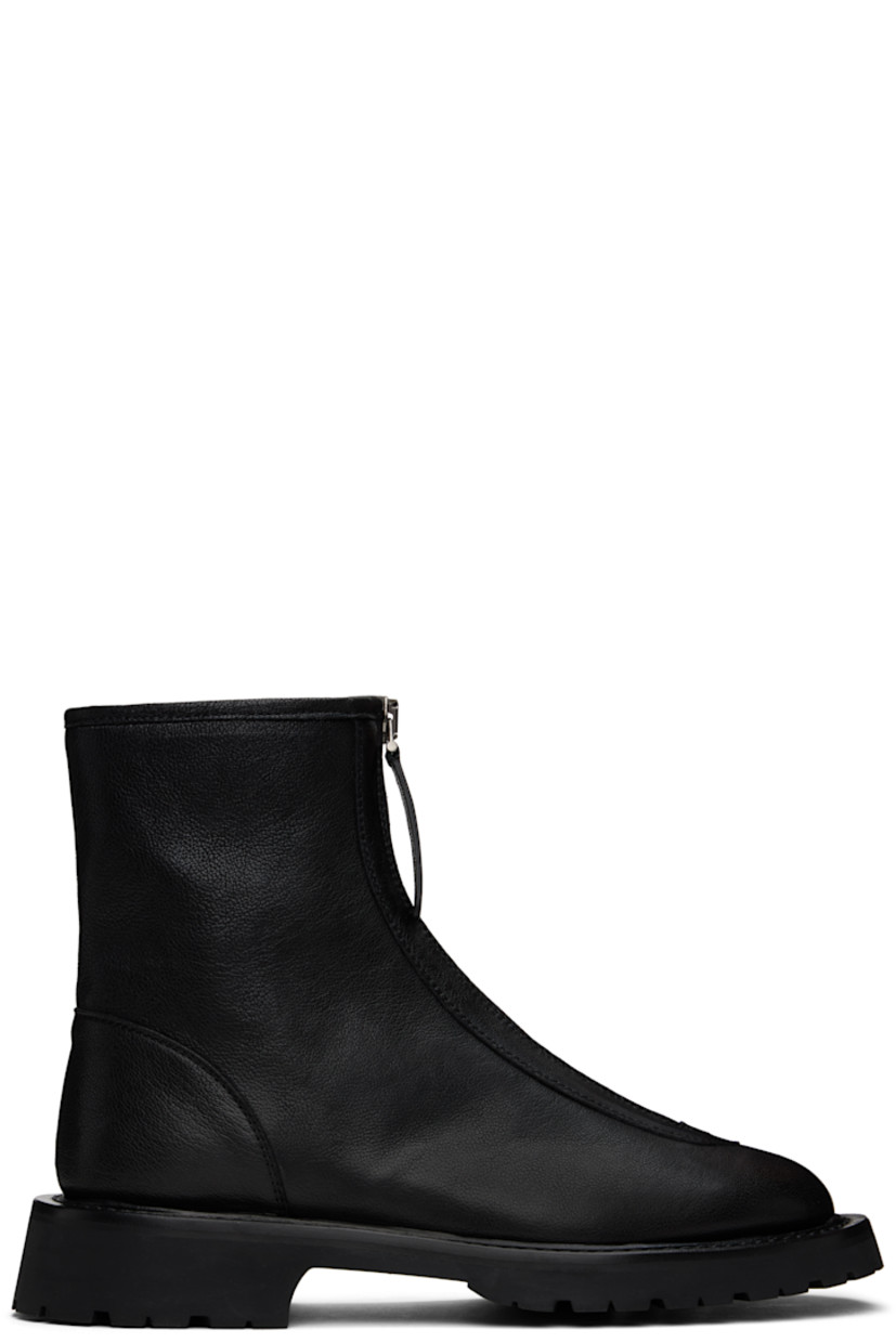 Ankle-high grained leather boots in black.

· Almond toe 
· Zip closure at vamp
· Grained leather lining
· Topstitching at welt 
· Treaded foam rubber sole

Supplier color: Black