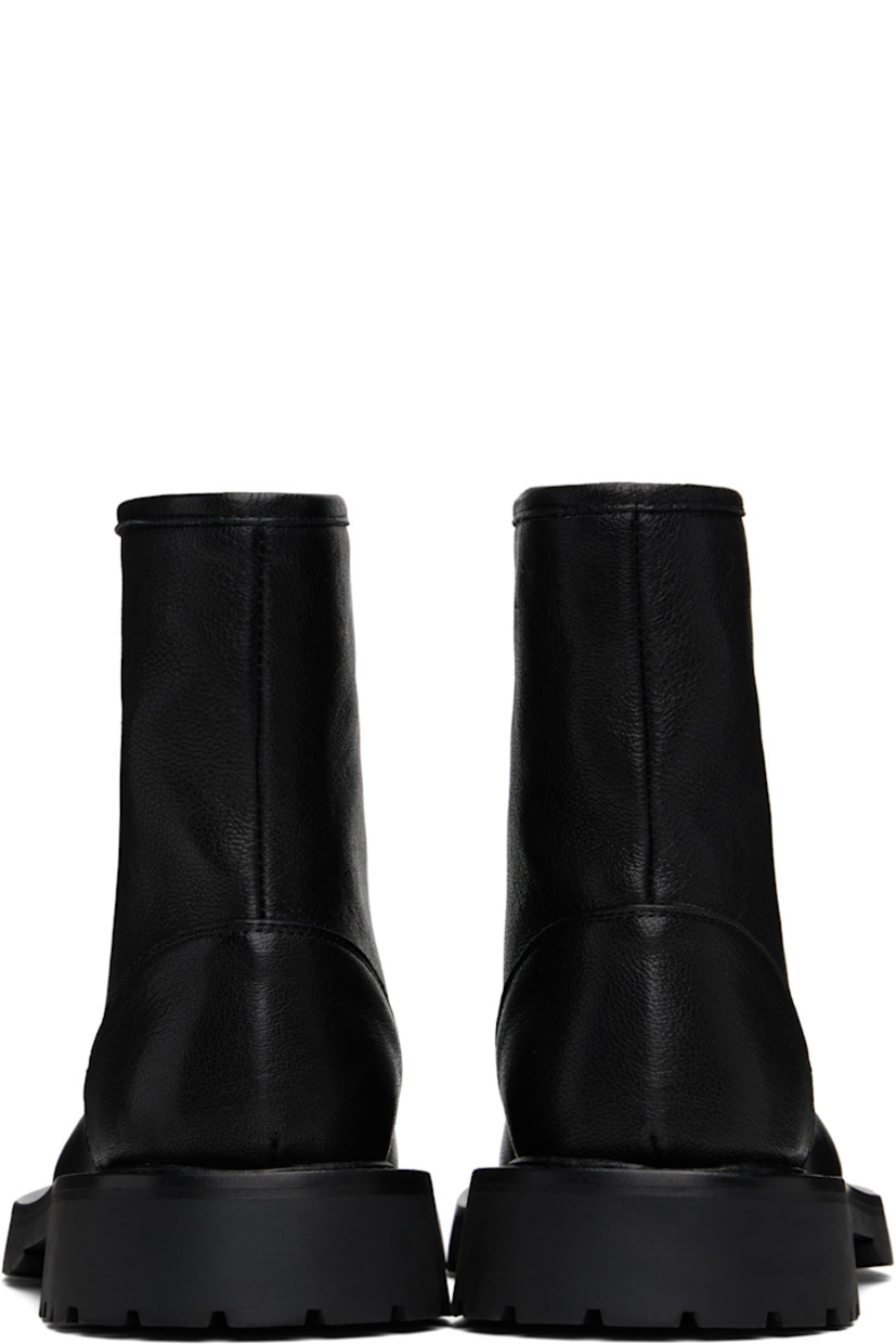 Ankle-high grained leather boots in black.

· Almond toe 
· Zip closure at vamp
· Grained leather lining
· Topstitching at welt 
· Treaded foam rubber sole

Supplier color: Black