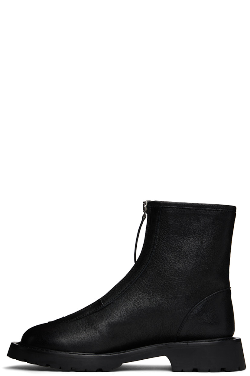 Ankle-high grained leather boots in black.

· Almond toe 
· Zip closure at vamp
· Grained leather lining
· Topstitching at welt 
· Treaded foam rubber sole

Supplier color: Black