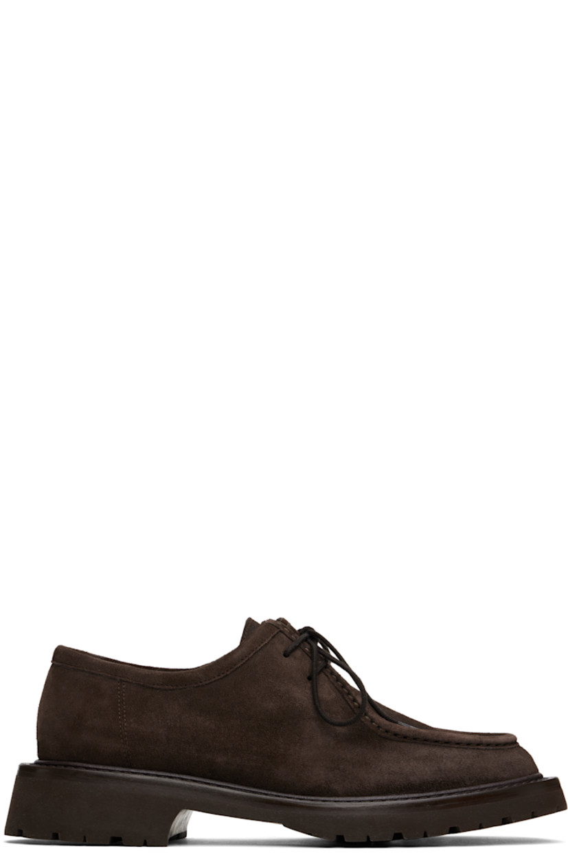 Suede derbys in brown.

· Moc toe
· Lace-up closure
· Buffed leather lining 
· Stacked leather midsole
· Treaded rubber sole
· Heel: H1.5"

Supplier color: Dark brown
