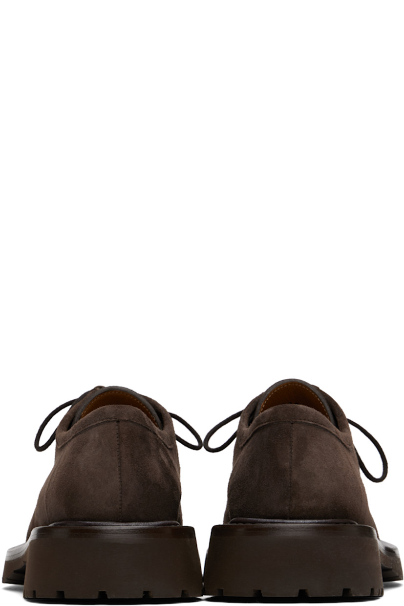 Suede derbys in brown.

· Moc toe
· Lace-up closure
· Buffed leather lining 
· Stacked leather midsole
· Treaded rubber sole
· Heel: H1.5"

Supplier color: Dark brown