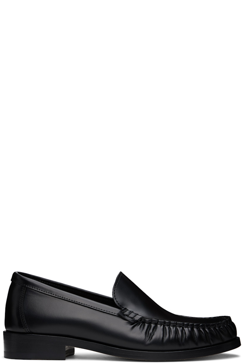 Boxed leather loafers in black.

· Ruching at moc toe
· Cushioned insole
· Grained leather lining
· Stacked leather heel with rubber injection
· Nubuck leather sole
· Heel: H1"

Supplier color: Black
