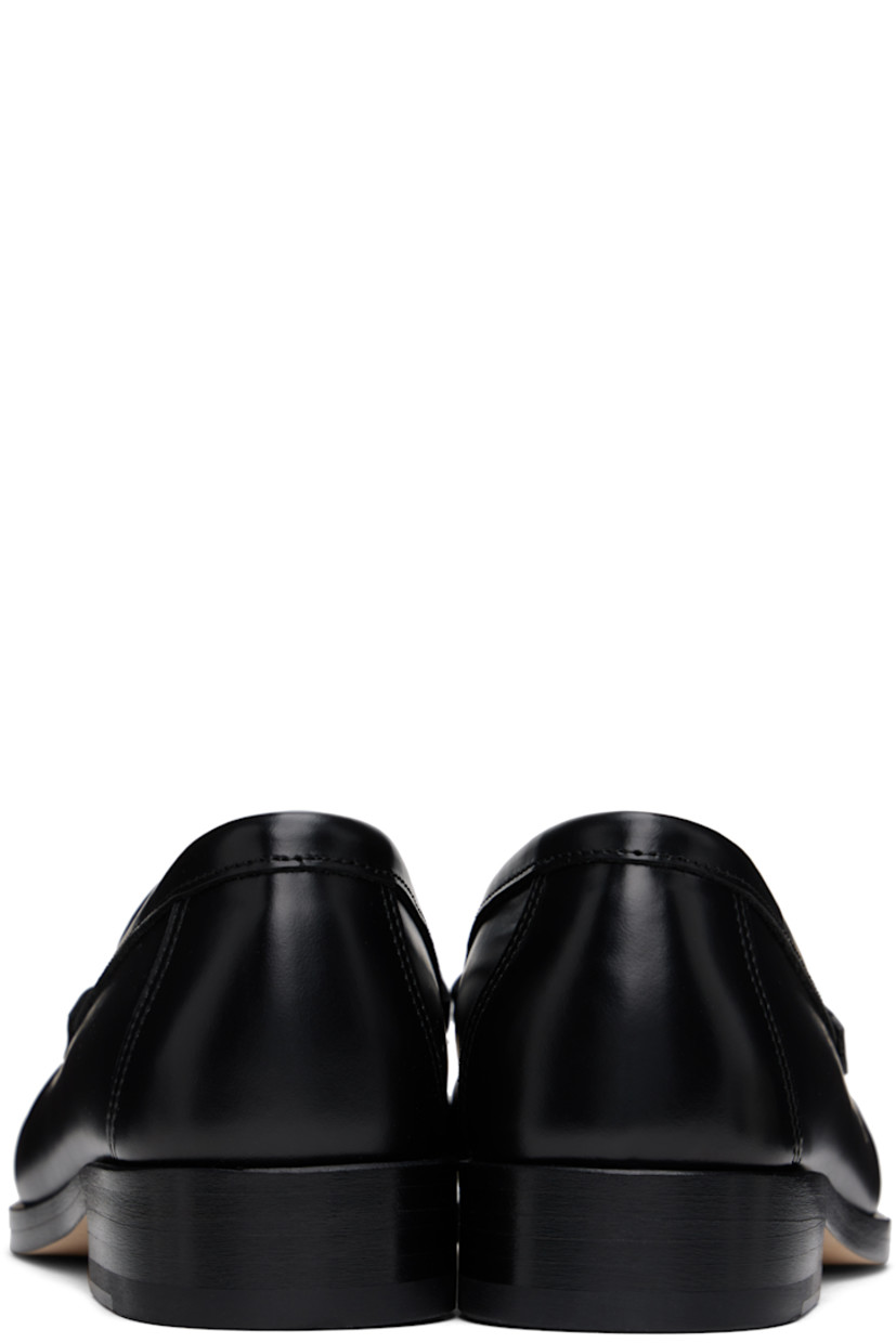 Boxed leather loafers in black.

· Ruching at moc toe
· Cushioned insole
· Grained leather lining
· Stacked leather heel with rubber injection
· Nubuck leather sole
· Heel: H1"

Supplier color: Black