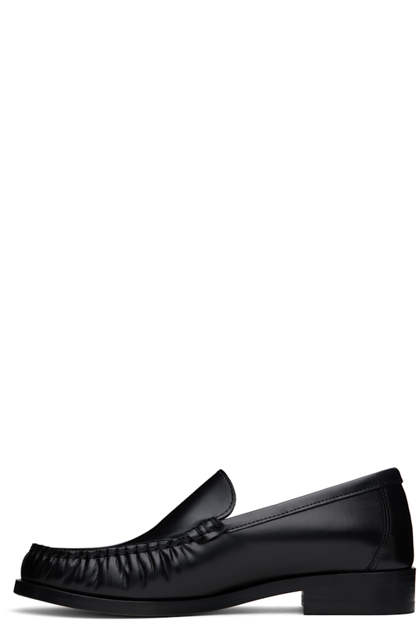 Boxed leather loafers in black.

· Ruching at moc toe
· Cushioned insole
· Grained leather lining
· Stacked leather heel with rubber injection
· Nubuck leather sole
· Heel: H1"

Supplier color: Black