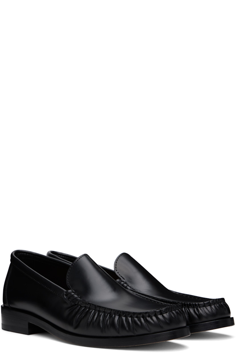 Boxed leather loafers in black.

· Ruching at moc toe
· Cushioned insole
· Grained leather lining
· Stacked leather heel with rubber injection
· Nubuck leather sole
· Heel: H1"

Supplier color: Black