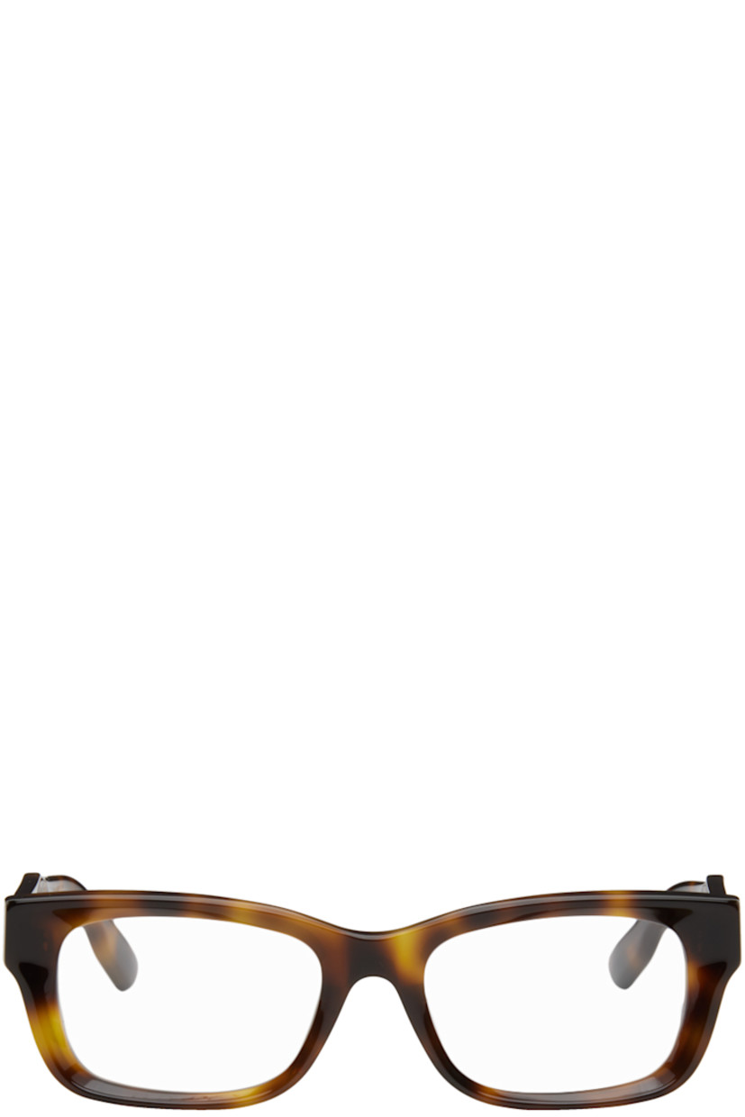 Square acetate-frame optical glasses in tortoiseshell.

· Integrated nose pads
· Logo hardware at temples
· Includes velvet hardside case
· Size: 52.19 145

Supplier color: Havana