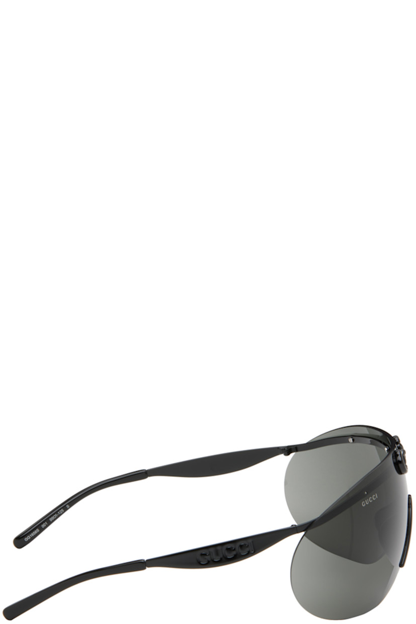 Shield-style rimless metal-frame sunglasses in black.

· Horsebit hardware at face 
· Gray lens
· 100% UVA/UVB protection 
· Logo etched at lens
· Integrated nose pads
· Logo embossed at temples
· Includes case
· Size: 99.1 125

Supplier color: Black