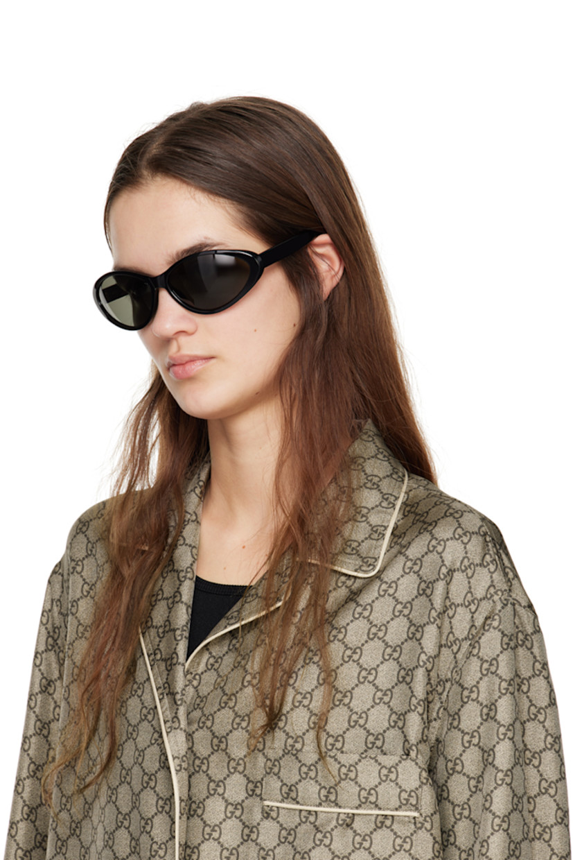 Cat-eye acetate-frame sunglasses in black.

· Gray lenses
· Logo etched at lens
· Integrated nose pads
· Inset logo hardware at temple tips
· Includes case
· Size: 67.15 130

Supplier color: Black