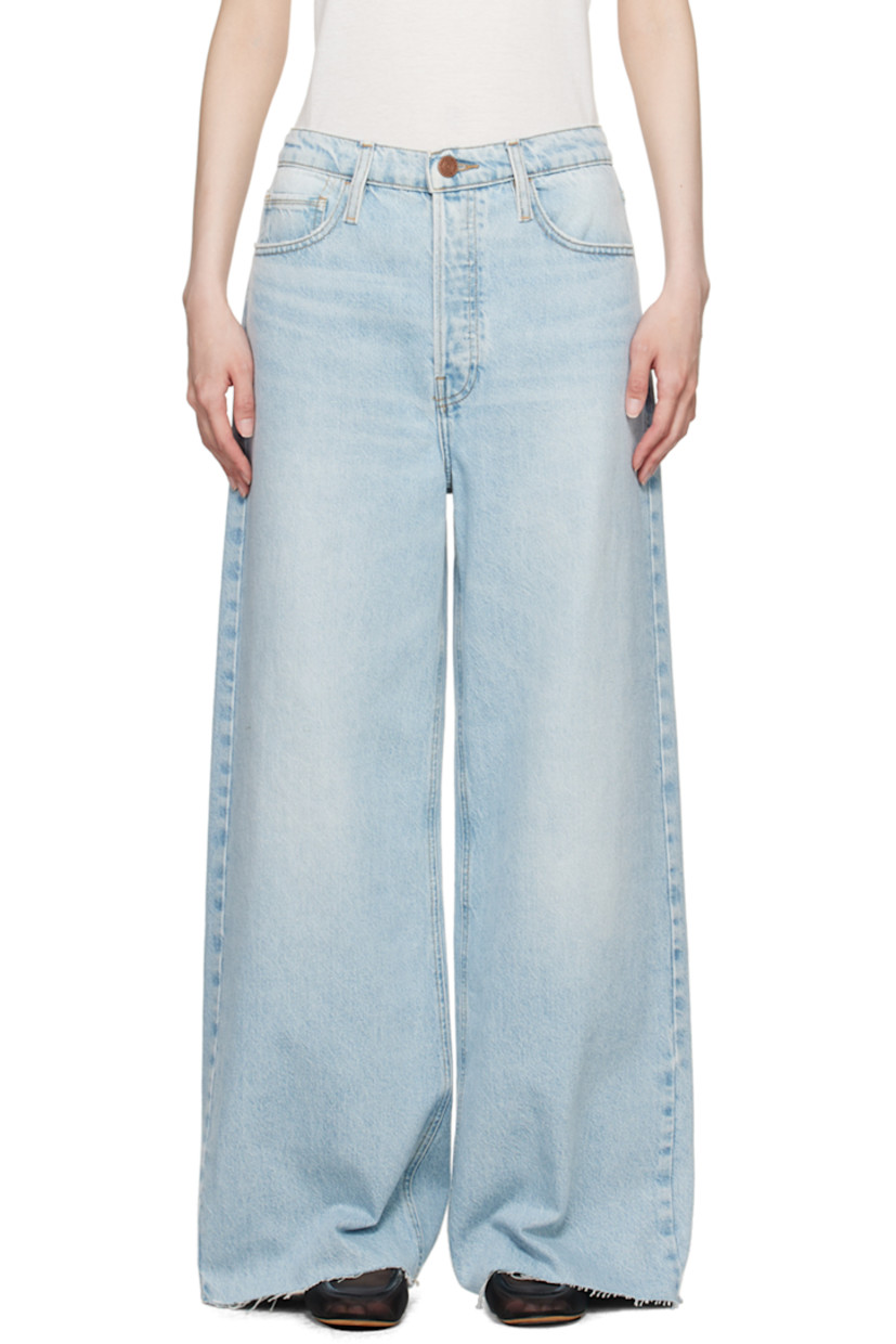 Loose-fit and wide-leg non-stretch regenerative cotton- and post-consumer recycled cotton-blend denim jeans. Fading and whiskering throughout. 

· Low-rise
· Belt loops
· Button-fly
· Raw edge at cuffs
· Logo-engraved copper-tone hardware
· Contrast stitching in tan

Supplier color: Fizz indigo