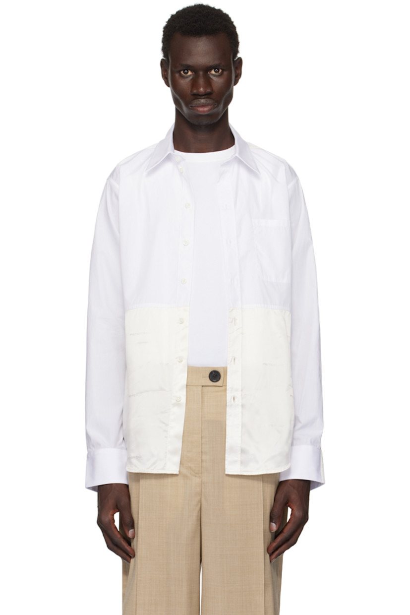 Cotton poplin and viscose satin shirt.

· Paneled construction
· Spread collar
· Button closure
· Shirttail hem
· Single-button barrel cuffs
· Pleats at back collar

Supplier color: White/Ivory