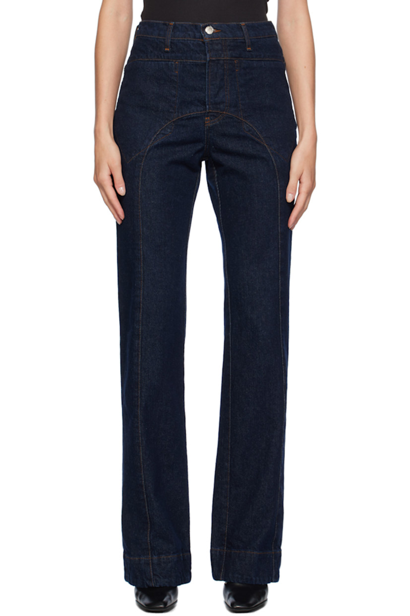 Slim-fit non-stretch recycled cotton-blend denim jeans. Fading throughout. 

· Belt loops
· Four-pocket styling
· Button-fly
· Central seams at front and back
· Logo patch at back waistband
· Logo-engraved silver-tone hardware
· Contrast stitching in brown

Supplier color: Indigo blue wash