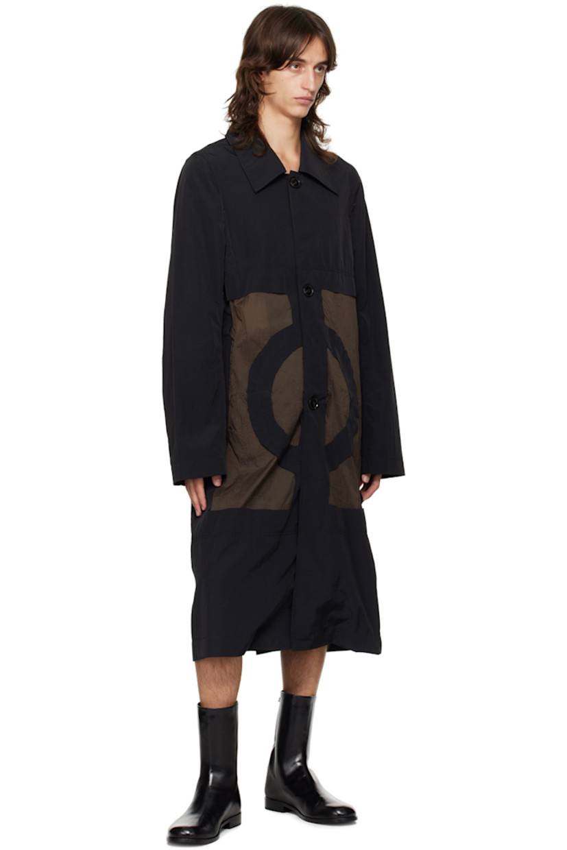 Nylon taffeta and crinkled nylon taffeta coat. 

· Paneled construction
· Spread collar
· Button closure
· Raw edges at front
· Welt pockets
· Locker loop at back collar
· Central vent at back hem

Supplier color: Black/Khaki grey