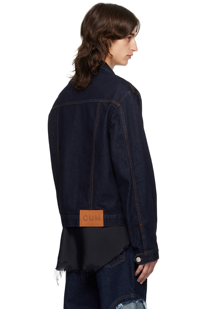 Non-stretch recycled cotton-blend denim jacket. 

· Spread collar
· Button closure
· Knife pleats at front
· Patch pockets
· Adjustable single-button barrel cuffs
· Logo patch at back hem
· Logo-engraved silver-tone hardware
· Contrast stitching in brown

Supplier color: Indigo blue wash