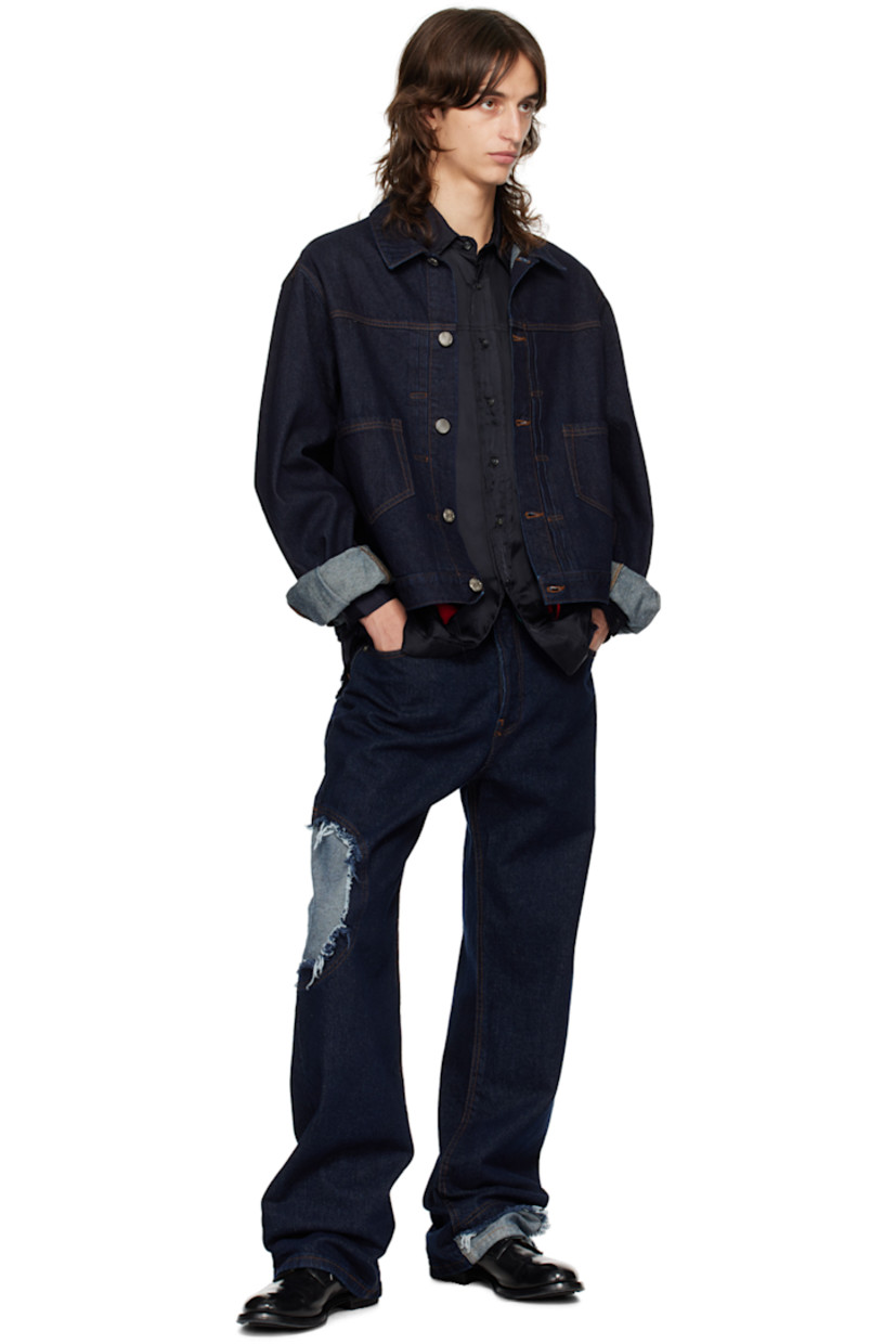 Non-stretch recycled cotton-blend denim jacket. 

· Spread collar
· Button closure
· Knife pleats at front
· Patch pockets
· Adjustable single-button barrel cuffs
· Logo patch at back hem
· Logo-engraved silver-tone hardware
· Contrast stitching in brown

Supplier color: Indigo blue wash