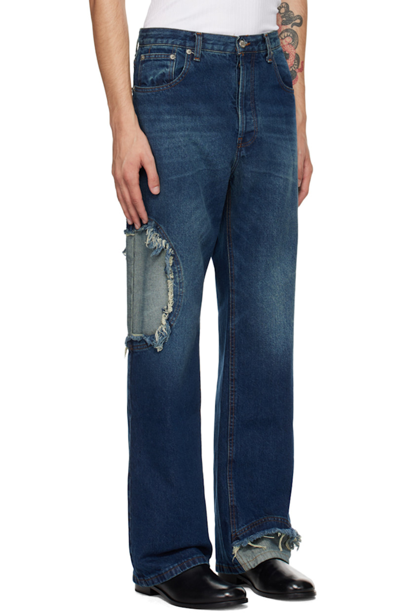 Non-stretch recycled cotton-blend denim jeans. Fading throughout.

· Belt loops
· Five-pocket styling
· Button-fly
· Inset panel with frayed edges at leg
· Logo patch at back waistband
· Logo-engraved silver-tone hardware
· Contrast stitching in brown

Supplier color: Mid-blue wash