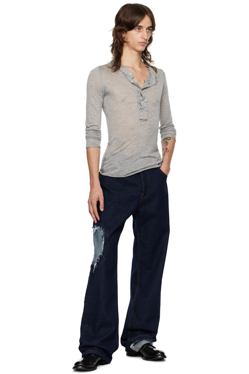 Semi-sheer modal jersey henley. Raw edges throughout.

· Crewneck
· Four-button placket

Supplier color: Grey marl