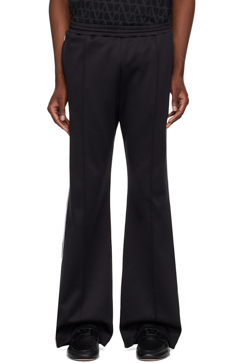 Nylon- and cotton-blend jersey sweatpants. 

· Concealed drawstring at elasticized waistband
· Three-pocket styling
· Pinched seams at front 
· Piping at outseams 
· Logo hardware at back pocket

Supplier color: Nero/Avorio