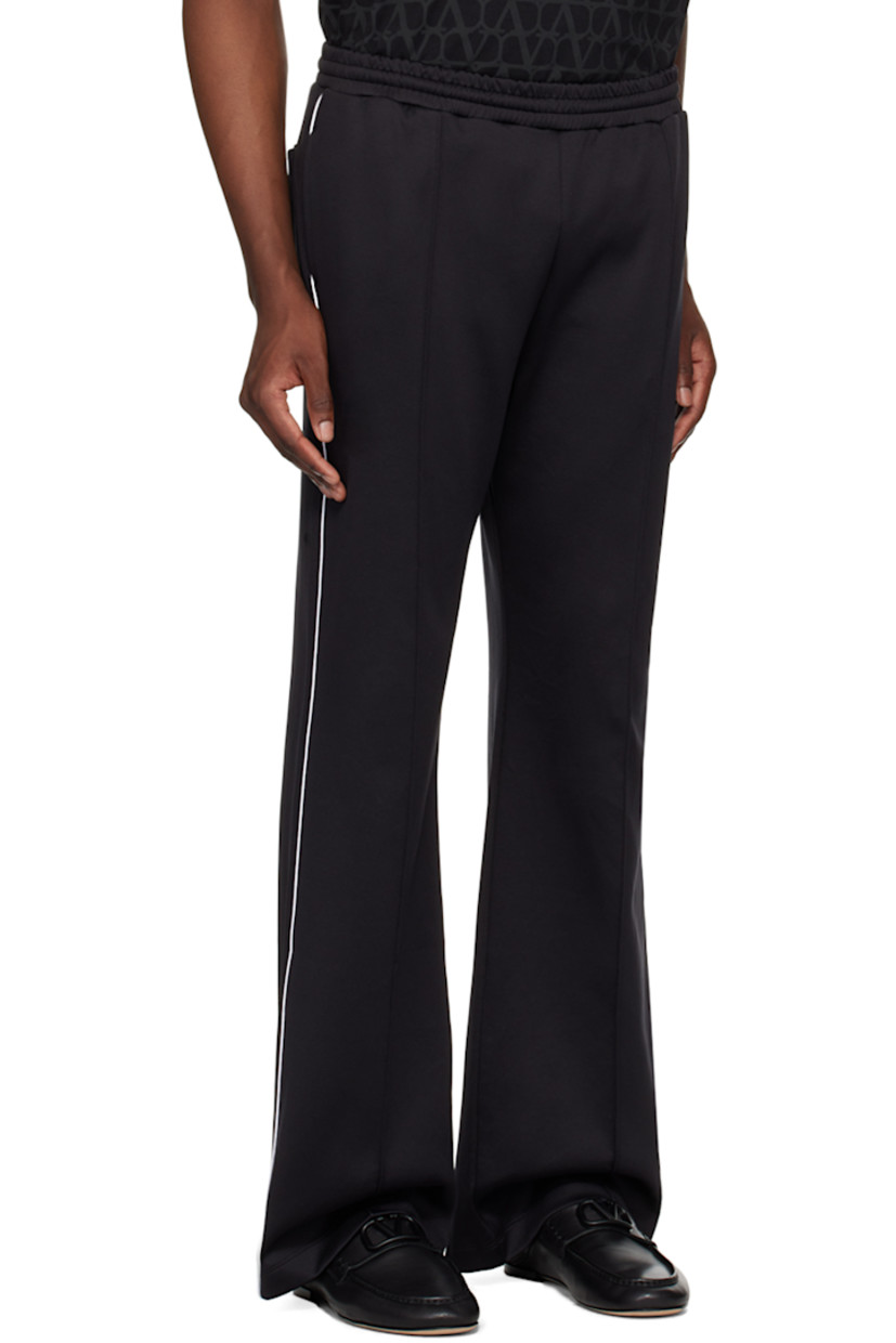 Nylon- and cotton-blend jersey sweatpants. 

· Concealed drawstring at elasticized waistband
· Three-pocket styling
· Pinched seams at front 
· Piping at outseams 
· Logo hardware at back pocket

Supplier color: Nero/Avorio