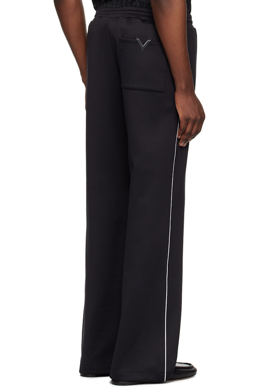 Nylon- and cotton-blend jersey sweatpants. 

· Concealed drawstring at elasticized waistband
· Three-pocket styling
· Pinched seams at front 
· Piping at outseams 
· Logo hardware at back pocket

Supplier color: Nero/Avorio