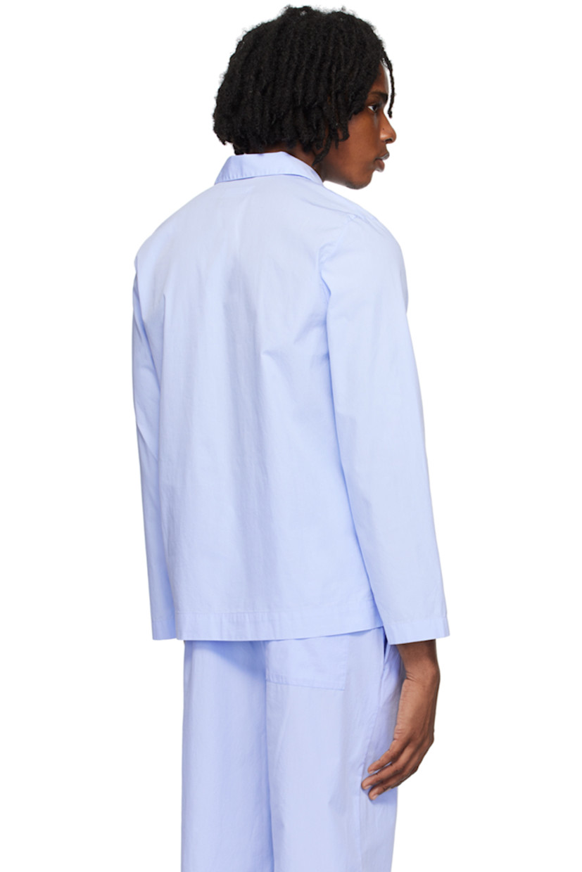Stonewashed lightweight Oeko-Tex® Standard 100-certified organic cotton poplin pyjama shirt. 

· Spread collar
· Button closure
· Patch pocket
· Logo flag at side seam
· Dropped shoulders
· Mother-of-pearl hardware

Supplier color: Shirt blue