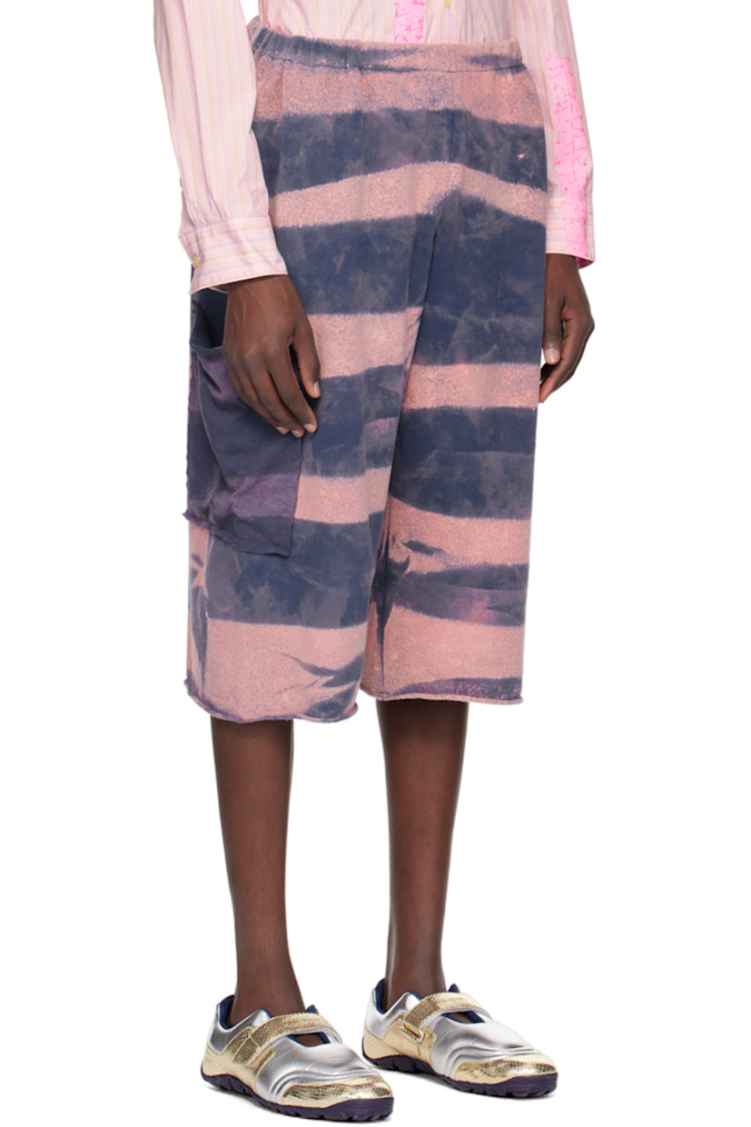 Cotton fleece shorts. Fading and stripes printed throughout. 

· Elasticized waistband 
· Rolled edge at cuffs 
· Patch pocket at outseams 

Available exclusively at SSENSE.

Supplier color: Warf