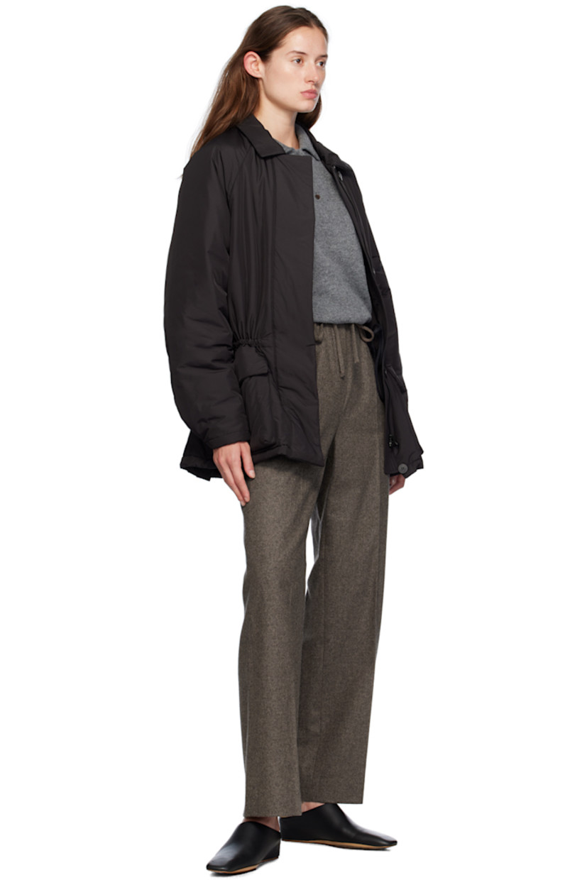Insulated polyester taffeta jacket.

· Button tab at spread collar
· Zip closure and button placket
· Concealed drawstring at waist
· Flap pockets
· Raglan sleeves
· Press-stud fastening at cuffs
· Storm flap at back
· Twin button vents at back hem
· Welt and flap pocket at interior
· Fully lined

Supplier color: Black