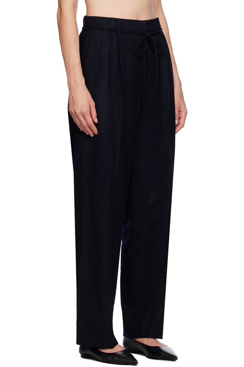 Straight-leg wool-blend flannel trousers.

· Belt loops 
· Drawstring at waist
· Four-pocket styling
· Zip-fly
· Pleats at front
· Creased legs 
· Partial satin lining

Supplier color: Navy